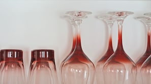 A row of wine glasses on a shelf. - Located In One Of The Oldest Streets Of The Historic Center Of Coyoacan (México D.F.)
