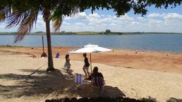On the beach, sun-loungers
