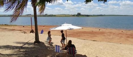 On the beach, sun-loungers