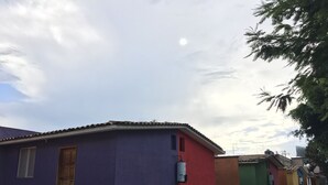 A row of colorful houses with a clear sky. - Perfect place for rest. Near to Oaxaca (Oaxaca)