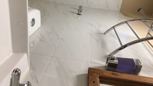 A bathroom with a white bathtub, a shower area, and a marble floor. - Perfect place for rest. Near to Oaxaca (Oaxaca)