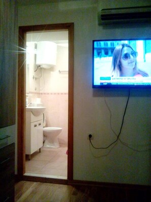 Shower, rainfall showerhead, hair dryer, towels