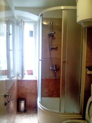Shower, rainfall showerhead, hair dryer, towels