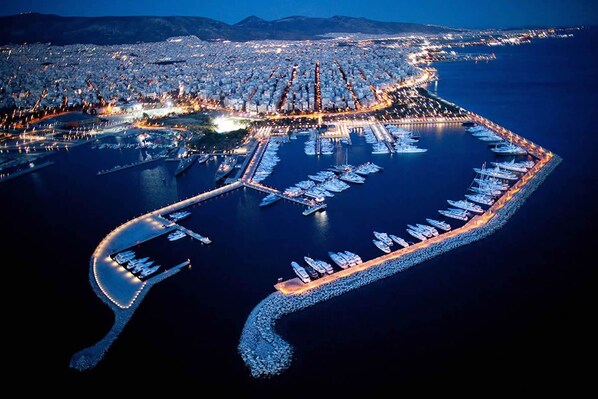 Moored boats line the marina, offering a glimpse into the bustling urban waterfront.