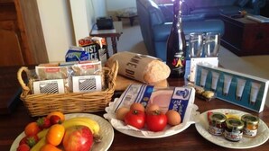 A kitchen counter with various food items, including fruits, bread, and condiments. - Friendly meeting chapel (North Adelaide)