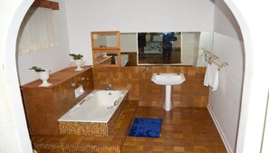 Bathtub, towels, toilet paper