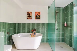 Combined shower/tub, hair dryer, towels, soap
