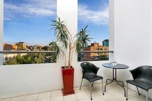 Outdoor dining - Surry Hills- SHILL - Campbell Street - Spacious 2BR Warehouse Apartment with Balcony Pool in The Carlisle, Surry Hills (Surry Hills)