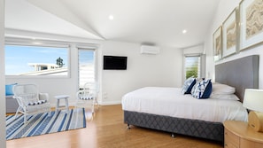 Relax in this stylish room with a large bed, flat-screen TV, and balcony.