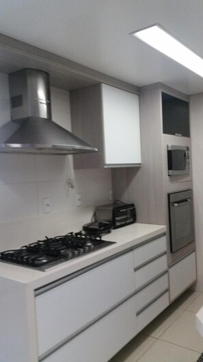 Enjoy cooking in this well-equipped kitchen with a gas stove, microwave, and oven.