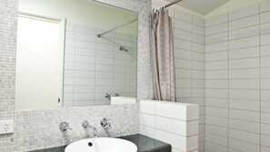 Combined shower/tub, hair dryer, towels, soap