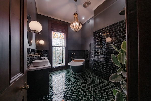 Bathtub, hair dryer, towels, soap