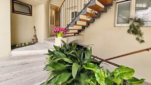 A modern staircase with a wooden finish and metal railings, leading to an upper floor. - Jager 2 Tour As / 1-room APP with AC, Wi-Fi, in the pedestrian zone (Ljubljana)