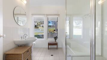 Bathtub, hair dryer, towels, soap