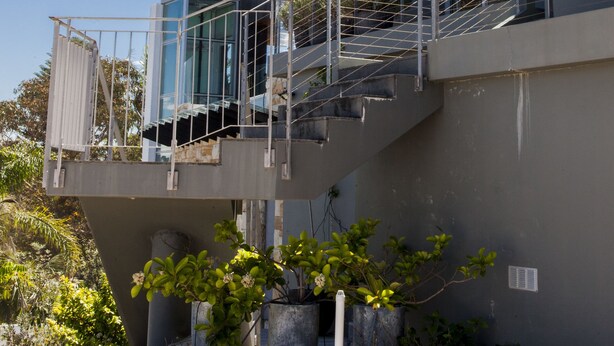 A modern multi-story building with glass balconies and a clear sky. - Quiet Relaxation Retreat Near Bondi Beach, The Cute Place To Put Up Your Feet (North Bondi)