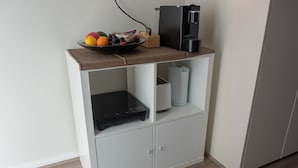 A kitchenette with a coffee maker, a fruit bowl, and a toaster. - Quiet Relaxation Retreat Near Bondi Beach, The Cute Place To Put Up Your Feet (North Bondi)