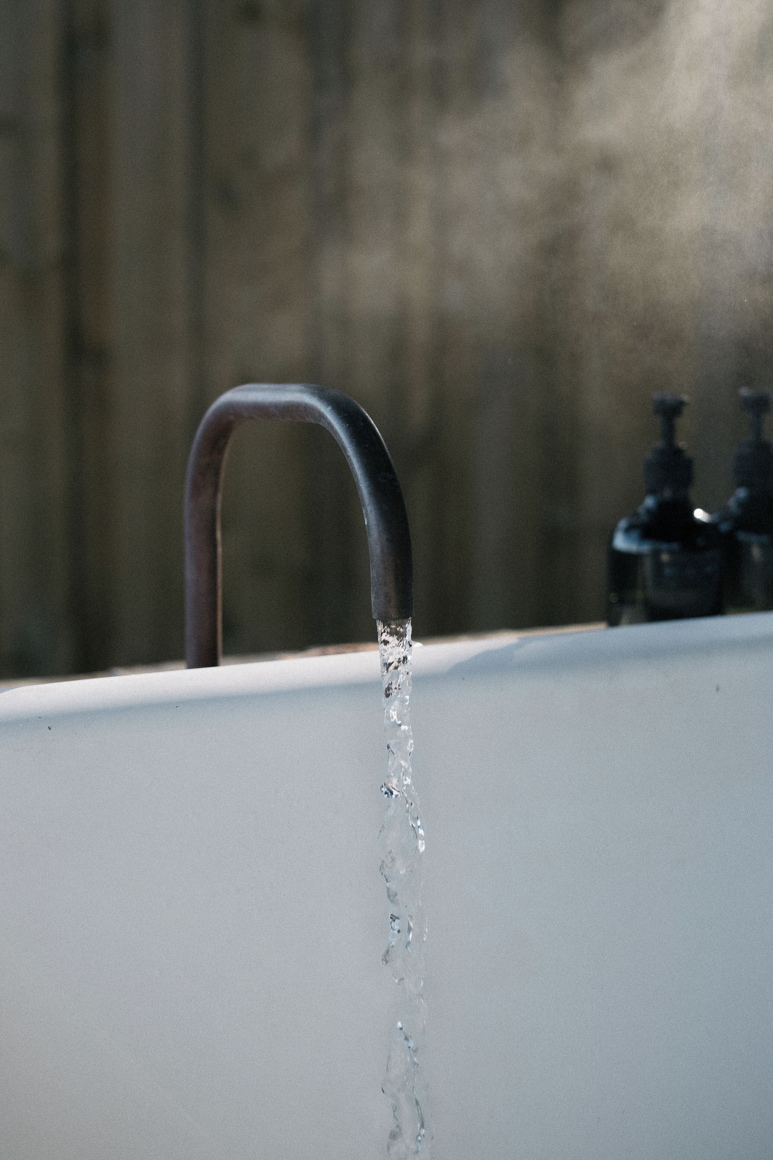 A faucet with water flowing from it.