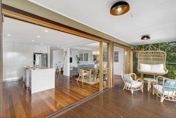 Open plan living, kitchen and dining areas which flow to the top deck
