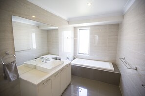 Bathtub, hair dryer, towels