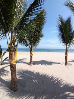 On the beach, sun loungers, beach towels