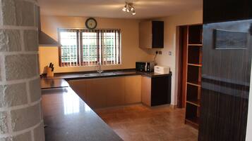 Fridge, microwave, oven, cookware/dishes/utensils