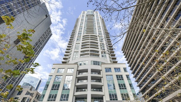 A high-rise building with multiple balconies, large windows, and a modern architectural design. - North Sydney - BS901 Berry Street - Modern 1BR with Balcony in the Heart of North Sydney CBD (North Sydney)