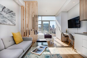 TV - Backup-Powered City Apartment with Breathtaking Views on Popular Bree Street  (Cape Town)