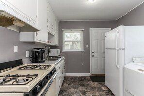 Cottage, 2 Bedrooms, Non Smoking | Private kitchen | Full-size fridge, microwave, oven, stovetop - House in Pensacola Tanyard District (Pensacola)