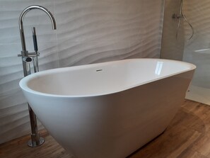 Bathtub, hair dryer, towels