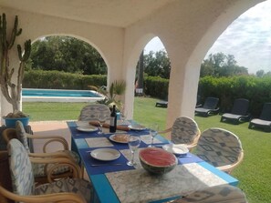 Outdoor dining - White washed villa with pool nr the beach at Pto Pollença (Pollença)