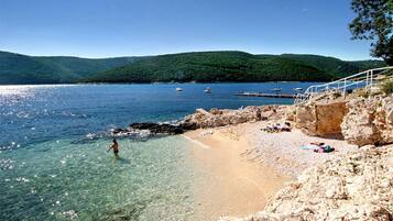 Beach nearby, sun loungers