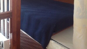A bunk bed with a blue mattress and a wooden headboard. - Apartment/ flat - PROPRIANO (Propriano)