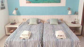 4 slaapkamers, een strijkplank/strijkijzer, reisbedje, gratis wifi