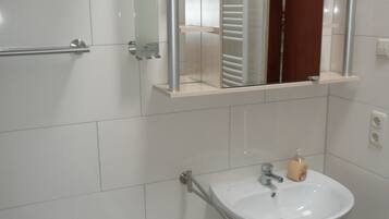 Bathtub, hair dryer, towels, soap