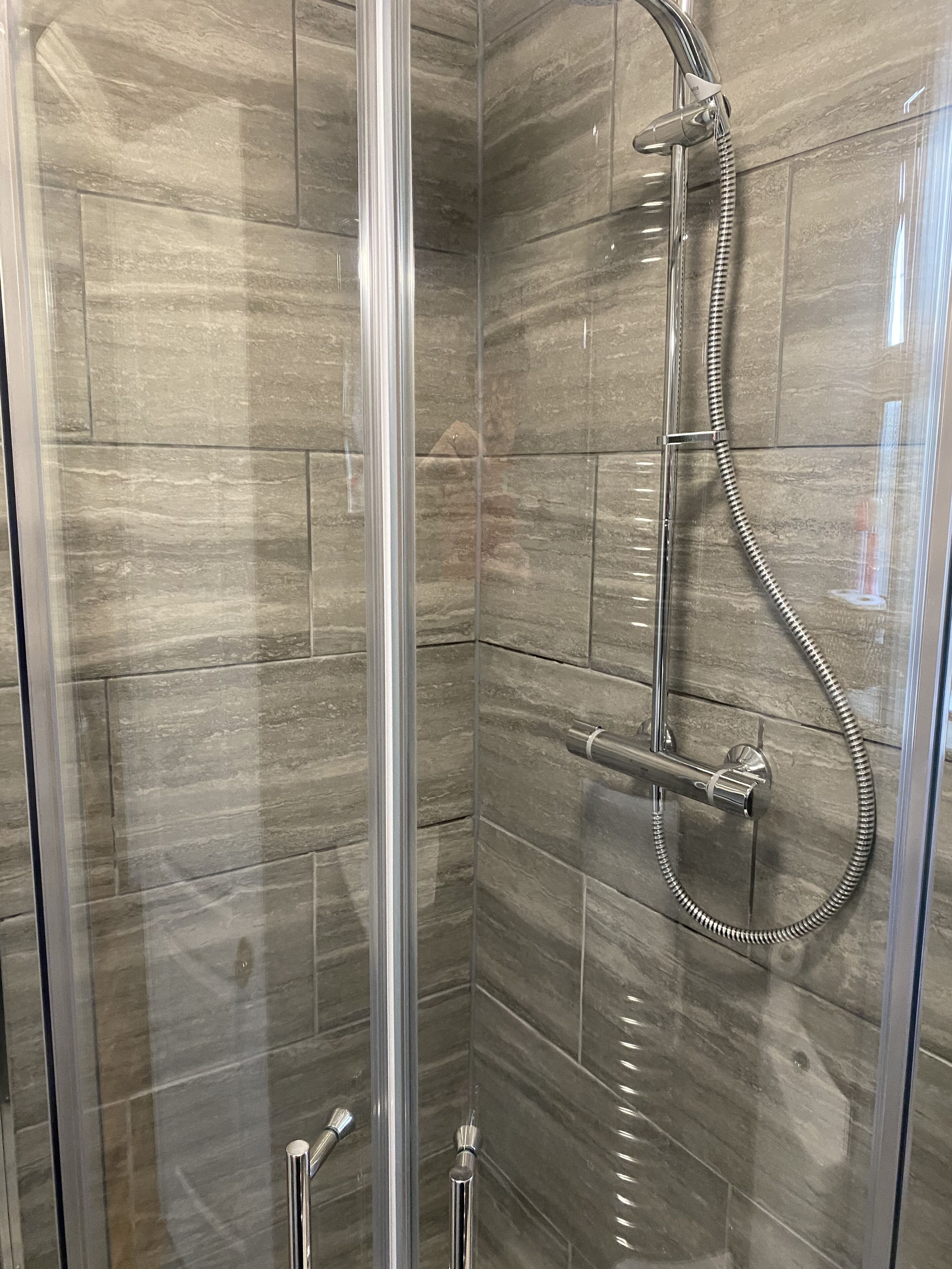 Bathtub, hair dryer, towels, soap