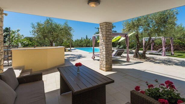 An outdoor patio area with a pool, seating, and a pergola. - 400m from Materada beach, pool, sun loungers, air conditioning  (Porec)