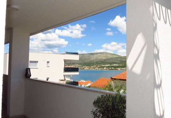 Enjoy breathtaking views of the coastline from this balcony.