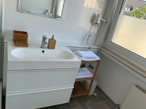 Hair dryer, towels, soap, toilet paper