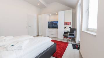 2 chambres, coffres-forts dans les chambres, fer et planche Ă repasser