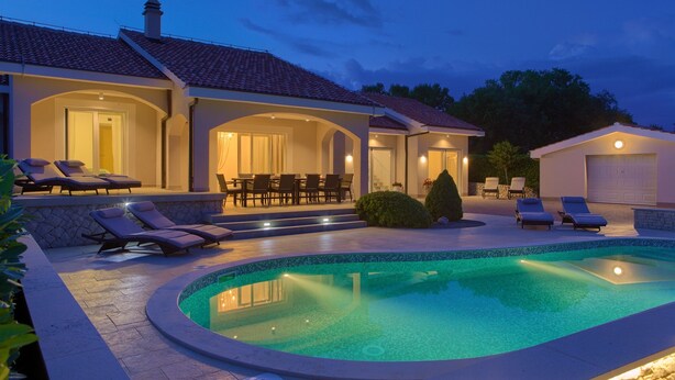 A swimming pool with lounge chairs and a covered patio area. - Villa Gardena with heated pool (Kvarner - Vrh) (Vrh)