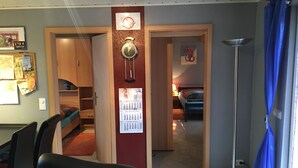 A room with a dining area, a kitchen, and a bedroom. - Quiet Holiday home in the middle of the Volcano Eifel (Rheinland-Pfalz)
