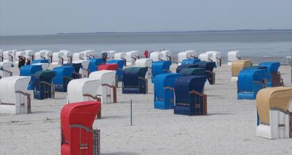 North Sea vacation in large vacation apartment balcony beach chair garden barbecue