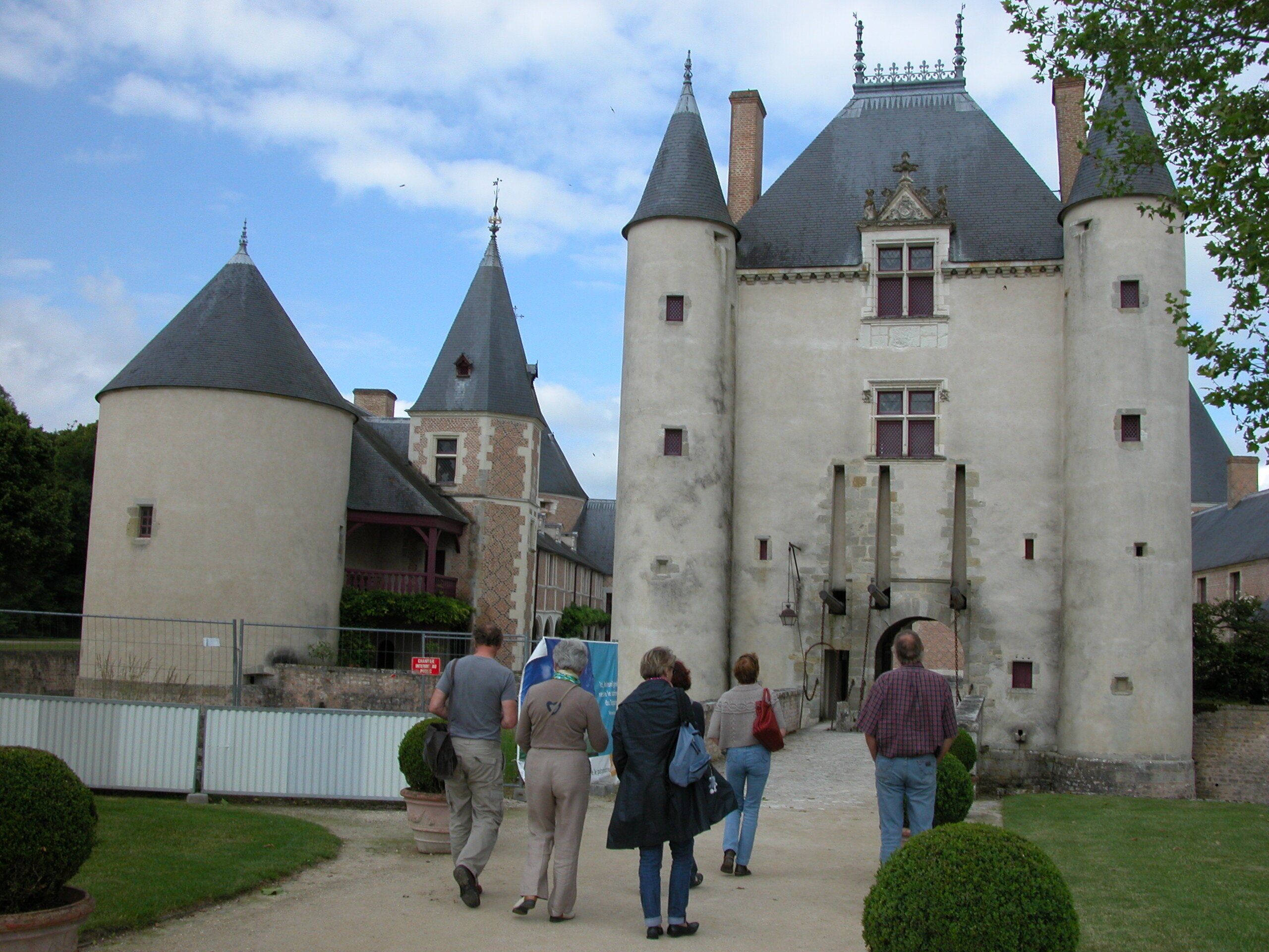 A castle with multiple towers and a central entrance.