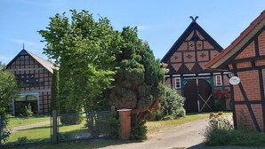 A traditional half-timbered building with a sign reading "Ferienwohnung."