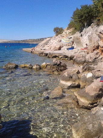 Beach. Villa Luce, apartment Maslina 70 m from the sea, with sea view at Karlobag.