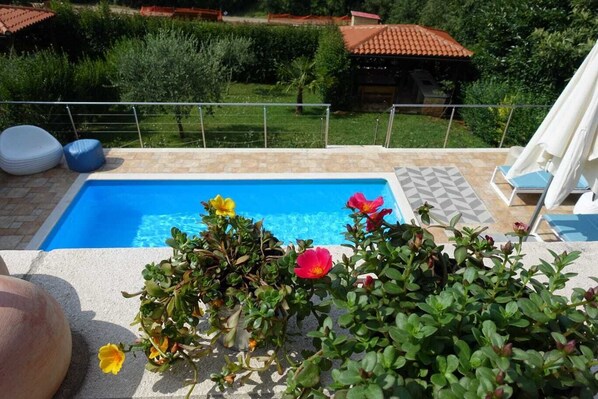 A heated pool, pool loungers