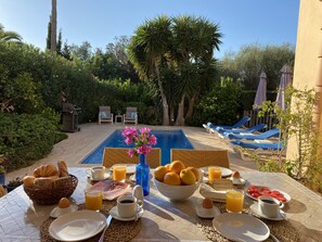 Outdoor pool, a heated pool, sun loungers
