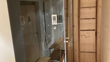 Shower, hair dryer, towels, soap