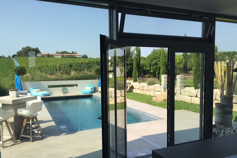 To the vintage villa with vineyards and a view of the Rhine valley
