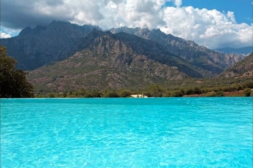 Charming stone house with views of the sea, mountains and swimming pool.
